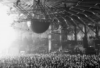 Crowd dancing at Awakenings Gashouder Amsterdam 2025, one of the biggest techno raves in the Netherlands, with a vibrant stage and light show.