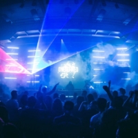 A euphoric crowd dances under flashing strobe lights of ONEDEFINED during a Fack It Club Night in Smederij, Tilburg.